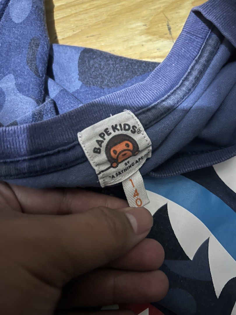 AUTHENTIC BAPE KIDS SHARK SHIRT (Category: Babies & Kids Fashion) located in Manila. Submitted by dplug (Listing ID 1469333646, Image 2). Description: Authentic/Legit/Original Size 140 Good Condition With 1 pinhole (see pic) -North Caloocan .