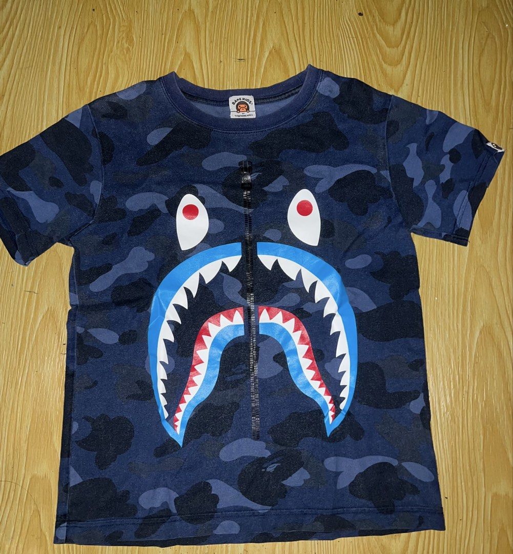 AUTHENTIC BAPE KIDS SHARK SHIRT (Category: Babies & Kids Fashion) located in Manila. Submitted by dplug (Listing ID 1469333646, Image 1). Description: Authentic/Legit/Original Size 140 Good Condition With 1 pinhole (see pic) -North Caloocan .