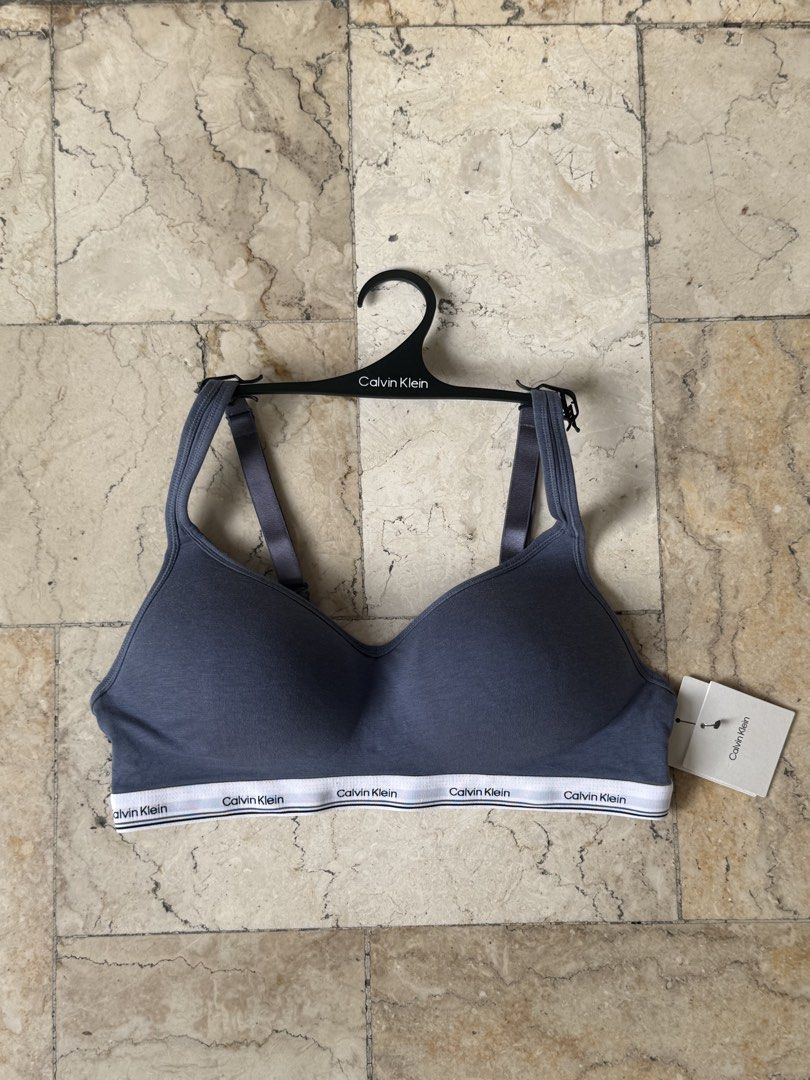 AUTHENTIC Calvin Klein Blue Underwear Bra (Category: Undergarments & Loungewear) located in San Pedro. Submitted by moonllax (Listing ID 1469239713, Image 1). Description: - Brand: Calvin Klein - Type: Wireless bra with matching branded hanger - Color: Grey with white logo band - Material: Super soft cotton - Features: Adjustable shoulder straps, iconic repeated logo on elastic band, side tag attached - Condition: Brand new - Ideal for: Everyday 