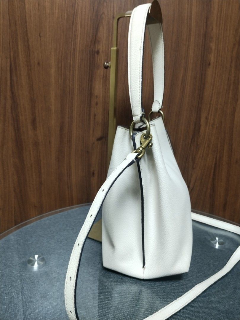Authentic Coach Willow Two-way Bucket Bag (Category: Cross-body Bags) located in Baguio. Submitted by luxuryvaultbagsandfashion (Listing ID 1469285941, Image 3). Description: Authentic Coach Willow Two-way Bucket Bag (Chalk / Off-White Leather)👜✨ Description: Up for grabs is an authentic Coach Willow Bucket Bag in classic Chalk/Off-White pebble leather with antique brass hardware. A timeless, versatile bag that can be styled as a shoulder bag or