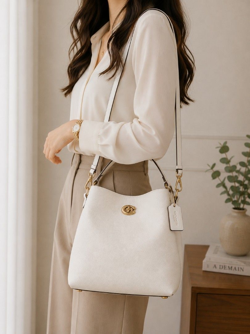 Authentic Coach Willow Two-way Bucket Bag (Category: Cross-body Bags) located in Baguio. Submitted by luxuryvaultbagsandfashion (Listing ID 1469285941, Image 1). Description: Authentic Coach Willow Two-way Bucket Bag (Chalk / Off-White Leather)👜✨ Description: Up for grabs is an authentic Coach Willow Bucket Bag in classic Chalk/Off-White pebble leather with antique brass hardware. A timeless, versatile bag that can be styled as a shoulder bag or