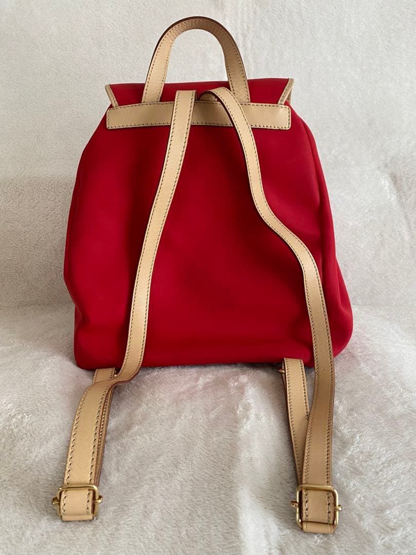 Authentic LANCEL Paris Backpack (Category: Backpacks) located in Pasig City. Submitted by talaversify (Listing ID 1469240761, Image 3). Description: • Authentic Lancel Paris Backpack in bright Red with Tan/Beige Leather Accents • Durable canvas/nylon body material, genuine leather straps and trim in gold-tone hardware fully functional • Secure top flap with buckle latch closure and adjustable drawstring opening • Two prominent front exterior pock