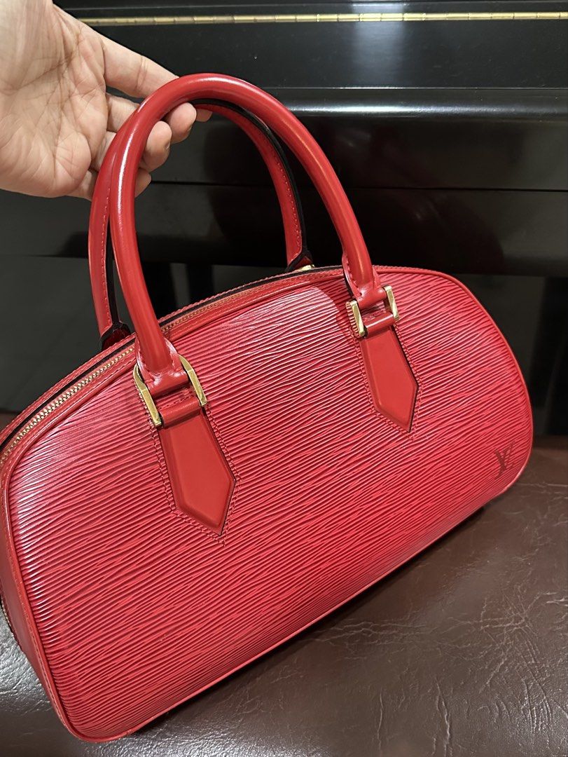 Authentic Louis Vuitton LV Epi Red Hand Bag (Category: Luxury Bags & Wallets) located in Las Pinas. Submitted by marshmallowmax (Listing ID 1469293025, Image 2). Description: Guaranteed Authentic! Slightly used like 9/10 condition. No flaws. With dustbag.