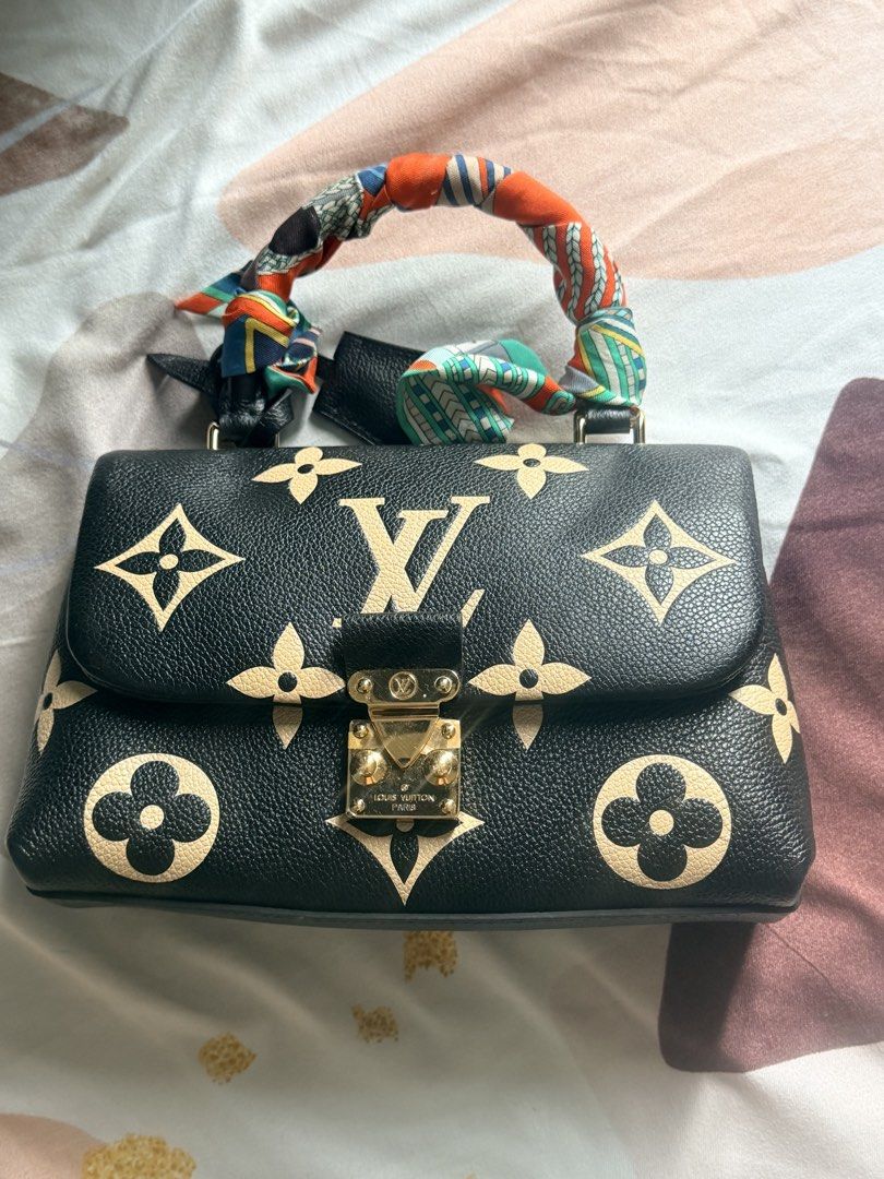 Authentic LV Madeleine (Category: Announcements) located in Bacolod City. Submitted by blackwidow28 (Listing ID 1469221277, Image 1). Description: Authentic Louis Vuitton Madeleine 🖤✨ Pre-loved condition with minor tarnishing on the hardware and hairline scratches on the lock from normal use. Aside from these, no other flaws noted. Please see the photos for the actual condition. ❤️ Microchipped Priced accordingly. Serious buyers only..
