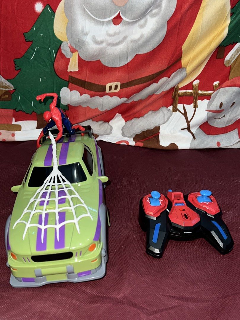 Authentic Marvel Spider-Man RC Car with Controller (Category: Remote Control Toys) located in Manila. Submitted by aiguuurl165091 (Listing ID 1469258997, Image 3). Description: - Official Marvel Spider-Man remote control toy car - Cool green and purple design with attached Spider-Man figure and white web hood detail - Includes matching red, black, and blue wireless controller with dual thumb sticks - Officially branded on the rear spoiler - Fully