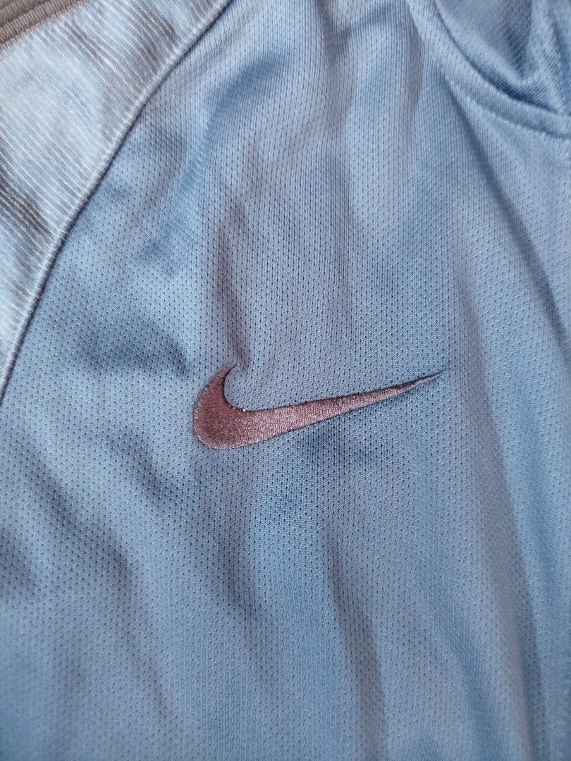 Authentic Nike Dri-FIT Blue Track Jacket (Category: Coats, Jackets and Outerwear) located in Rizal. Submitted by silenttiger_43bf91 (Listing ID 1469194843, Image 3). Description: - Authentic blue Nike training jacket - Dri-FIT moisture-wicking material keeps you dry during workouts - Full zip front with high collar and ribbed cuffs - Stylish darker blue stripes down shoulders and sleeves - Embroidered Nike swoosh on right chest - Perfect for gym 