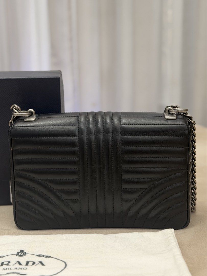 Authentic Prada Diagramme Chain Flap Bag in Medium size (Category: Luxury Bags & Wallets) located in Manila. Submitted by maria_2326 (Listing ID 1458394589, Image 3). Description: Prada Diagramme Chain Flap Medium Size Guarantee Authentic Inclusions: Box and dust bag No to lowballing! Location: Manila/QC.