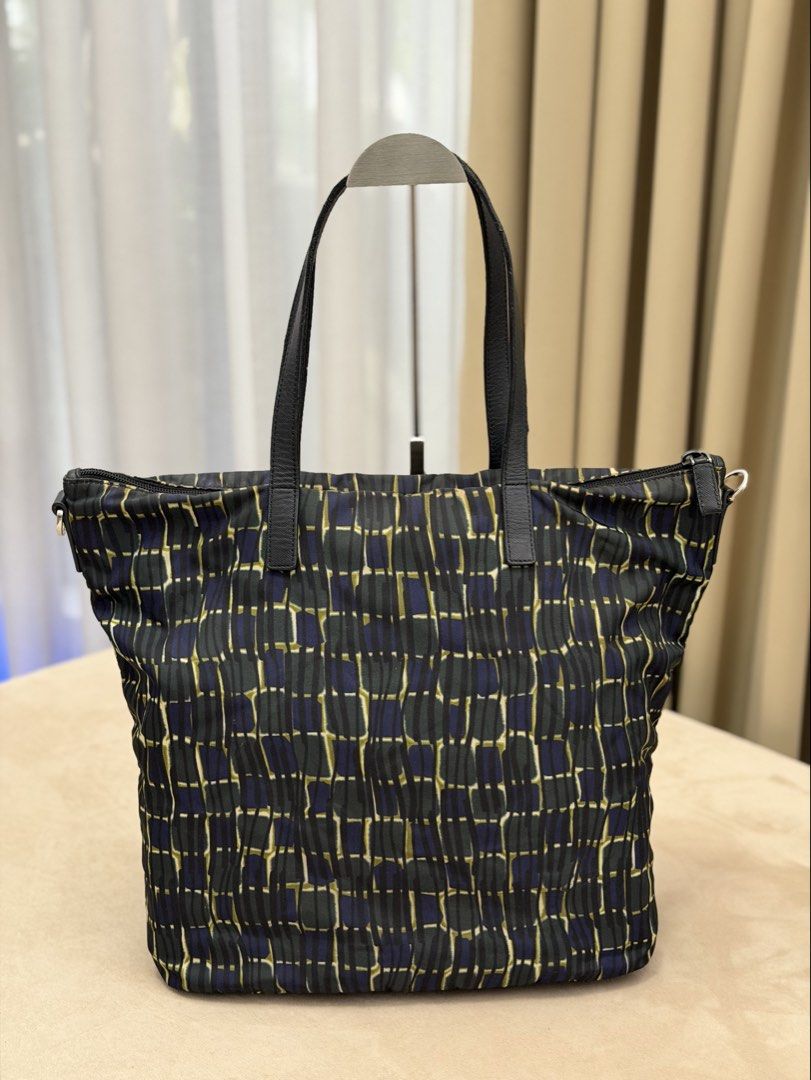 Authentic Prada Tessuto Nylon Printed Tote Bag (Category: Tote Bags) located in Manila. Submitted by maria_2326 (Listing ID 1469350222, Image 2). Description: 💯% Authentic No inclusions | fits up to 16” laptop Flaw: Handle glazing (see last photo) Location: Manila/QC.