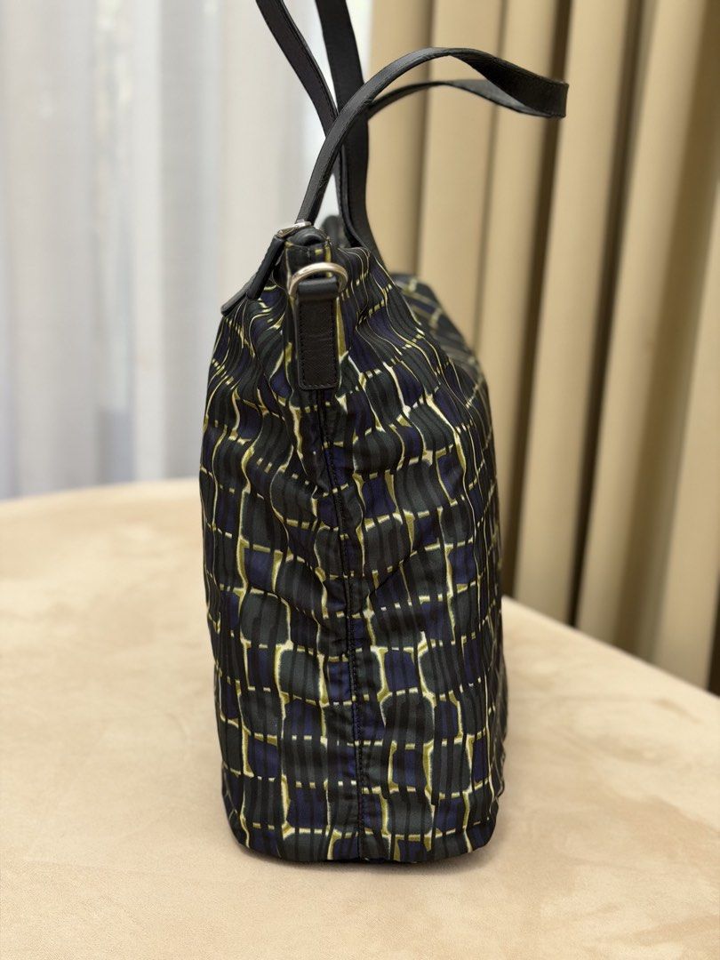 Authentic Prada Tessuto Nylon Printed Tote Bag (Category: Tote Bags) located in Manila. Submitted by maria_2326 (Listing ID 1469350222, Image 3). Description: 💯% Authentic No inclusions | fits up to 16” laptop Flaw: Handle glazing (see last photo) Location: Manila/QC.