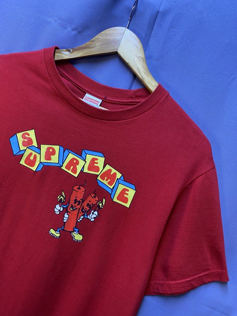 Authentic Supreme “Dynamite” Tee (Category: Tshirts & Polo Shirts ) located in Makati City. Submitted by drip.poww (Listing ID 1469344036, Image 2). Description: - Authentic Supreme - Color: Red - Size: Small - Dimes: 21x28 - Authentic - Baby hairline - Excellent condition - Need wash, fresh from bale - Material: 100% Cotton Please don’t expect too much—these are thrifted (ukay) items. 😊 !!STILL NEGOTIABLE!!.