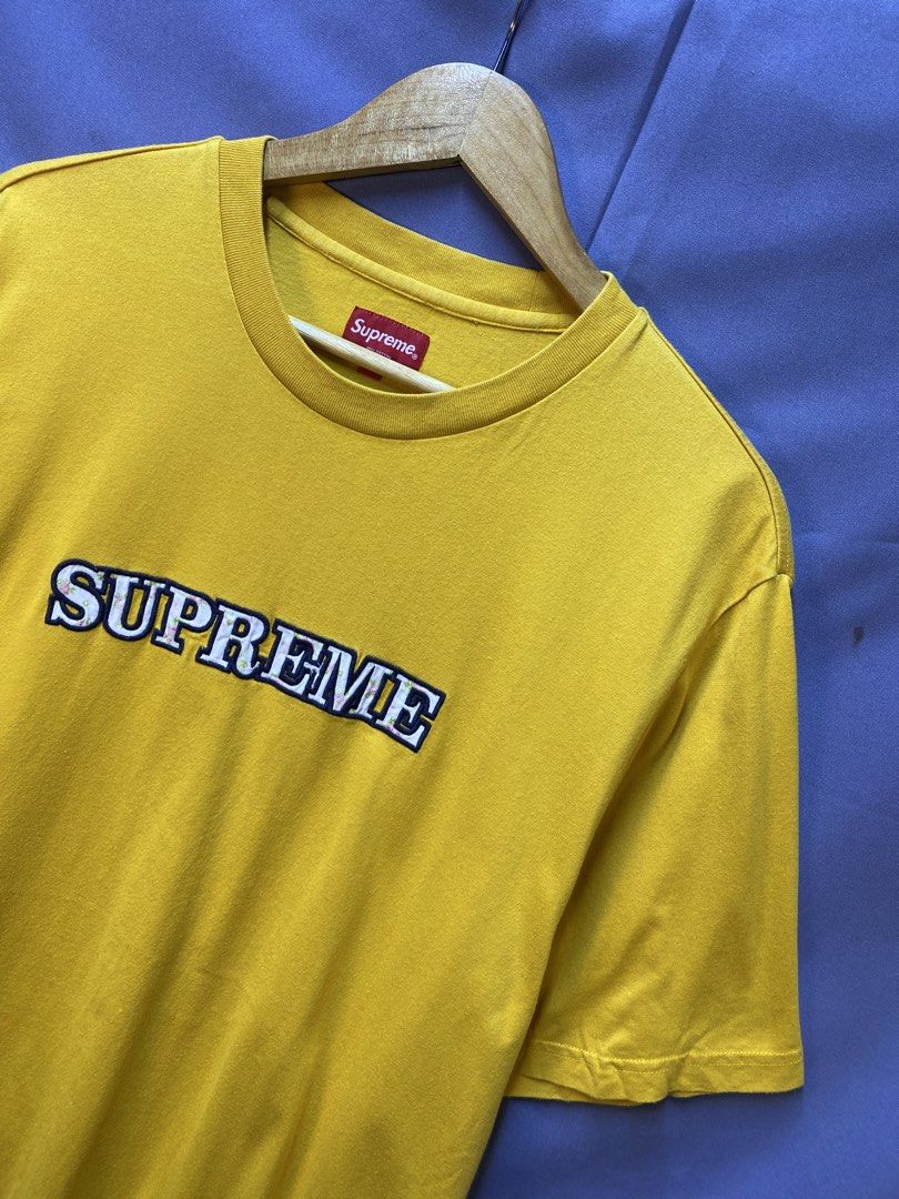 Authentic Supreme “Floral Logo” Tee (Category: Tshirts & Polo Shirts ) located in Makati City. Submitted by drip.poww (Listing ID 1469342984, Image 2). Description: - Authentic Supreme - Color: Mustard - Size: Large - Dimes: 22x28 - Authentic - Excellent condition - Need wash, fresh from bale - Material: 100% Cotton Please don’t expect too much—these are thrifted (ukay) items. 😊 !!STILL NEGOTIABLE!!.