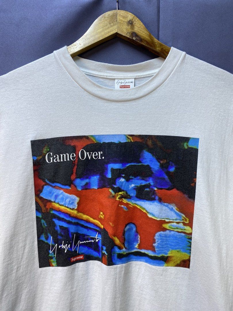 Authentic Supreme x Yohji Yamamoto “Game Over” Tee (Category: Tshirts & Polo Shirts ) located in Makati City. Submitted by drip.poww (Listing ID 1469342562, Image 3). Description: - Authentic Supreme - Color: White - Size: 21x27 - Dimes: - Authentic - Excellent condition - Baby hairline for safety - Need wash, fresh from bale - Material: 100% Cotton Please don’t expect too much—these are thrifted (ukay) items. 😊 !!STILL NEGOTIABLE!!.