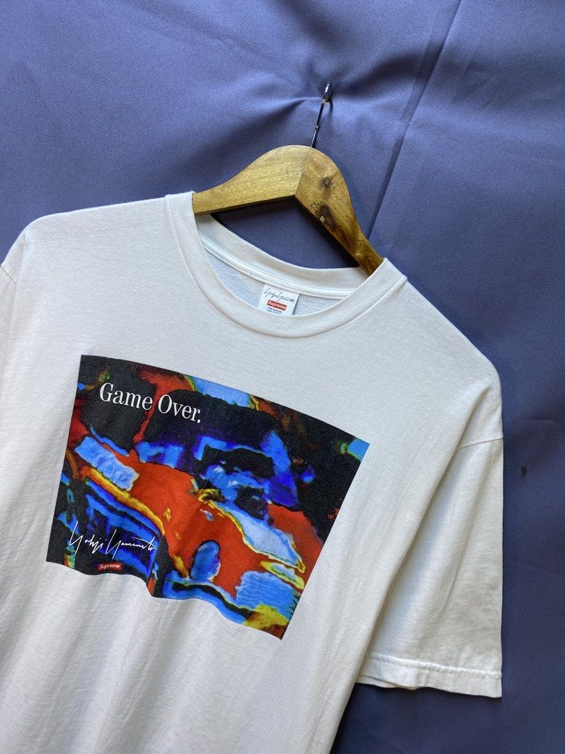 Authentic Supreme x Yohji Yamamoto “Game Over” Tee (Category: Tshirts & Polo Shirts ) located in Makati City. Submitted by drip.poww (Listing ID 1469342562, Image 2). Description: - Authentic Supreme - Color: White - Size: 21x27 - Dimes: - Authentic - Excellent condition - Baby hairline for safety - Need wash, fresh from bale - Material: 100% Cotton Please don’t expect too much—these are thrifted (ukay) items. 😊 !!STILL NEGOTIABLE!!.