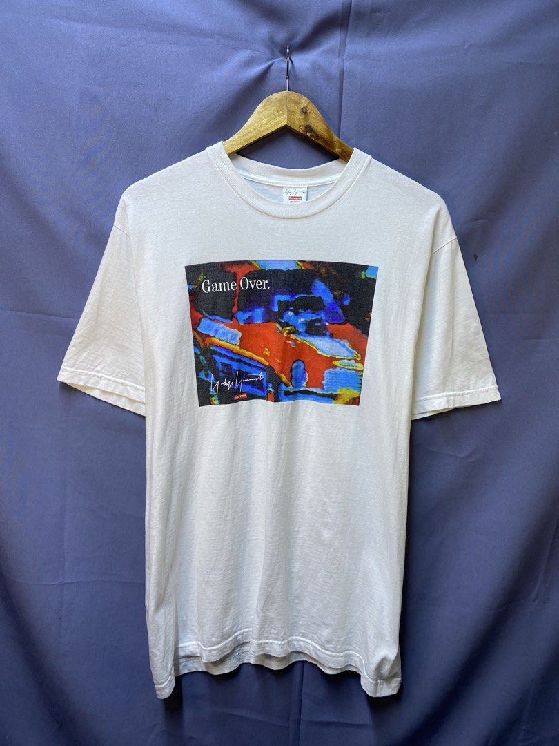 Authentic Supreme x Yohji Yamamoto “Game Over” Tee (Category: Tshirts & Polo Shirts ) located in Makati City. Submitted by drip.poww (Listing ID 1469342562, Image 1). Description: - Authentic Supreme - Color: White - Size: 21x27 - Dimes: - Authentic - Excellent condition - Baby hairline for safety - Need wash, fresh from bale - Material: 100% Cotton Please don’t expect too much—these are thrifted (ukay) items. 😊 !!STILL NEGOTIABLE!!.