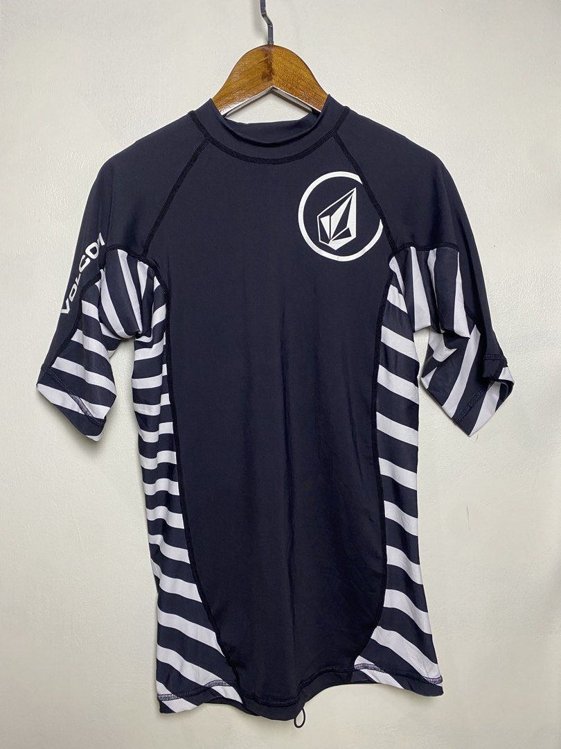 Authentic volcom rash guard size M (Category: Activewear) located in Makati City. Submitted by indaysukaycloset (Listing ID 1469172272, Image 1). Description: VOLCOM RADIANT S/S THRASHGUARD RASHGUARD - SIZE M For sale: Original Volcom Rashguard in excellent condition! DETAILS: Brand: Volcom (100% Original, with tags) Size: M - fits M to L Color: Navy Blue / White Stripes Material: 85% Polyester 15% Elastane - stretchy, quick-dry, comfy Style: Rad