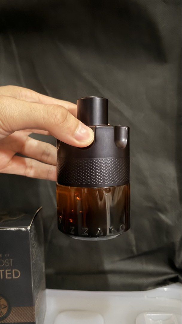 Azzaro The Most Wanted Parfum 100mL (Category: Fragrance & Deodorants) located in Cainta. Submitted by coolwhale.804534 (Listing ID 1469200597, Image 2). Description: - Item: Azzaro The Most Wanted Parfum - Size: 100mL (Iconic gun-cylinder bottle) - Condition: Near full, barely sprayed; includes original outer box with slight shelf wear - Performance: Rich amber juice with great longevity and projection 80-85ml with box 3.2k slightly nego cainta,