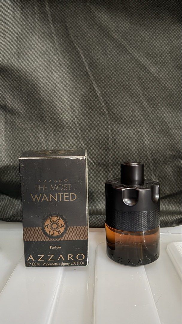 Azzaro The Most Wanted Parfum 100mL (Category: Fragrance & Deodorants) located in Cainta. Submitted by coolwhale.804534 (Listing ID 1469200597, Image 1). Description: - Item: Azzaro The Most Wanted Parfum - Size: 100mL (Iconic gun-cylinder bottle) - Condition: Near full, barely sprayed; includes original outer box with slight shelf wear - Performance: Rich amber juice with great longevity and projection 80-85ml with box 3.2k slightly nego cainta,