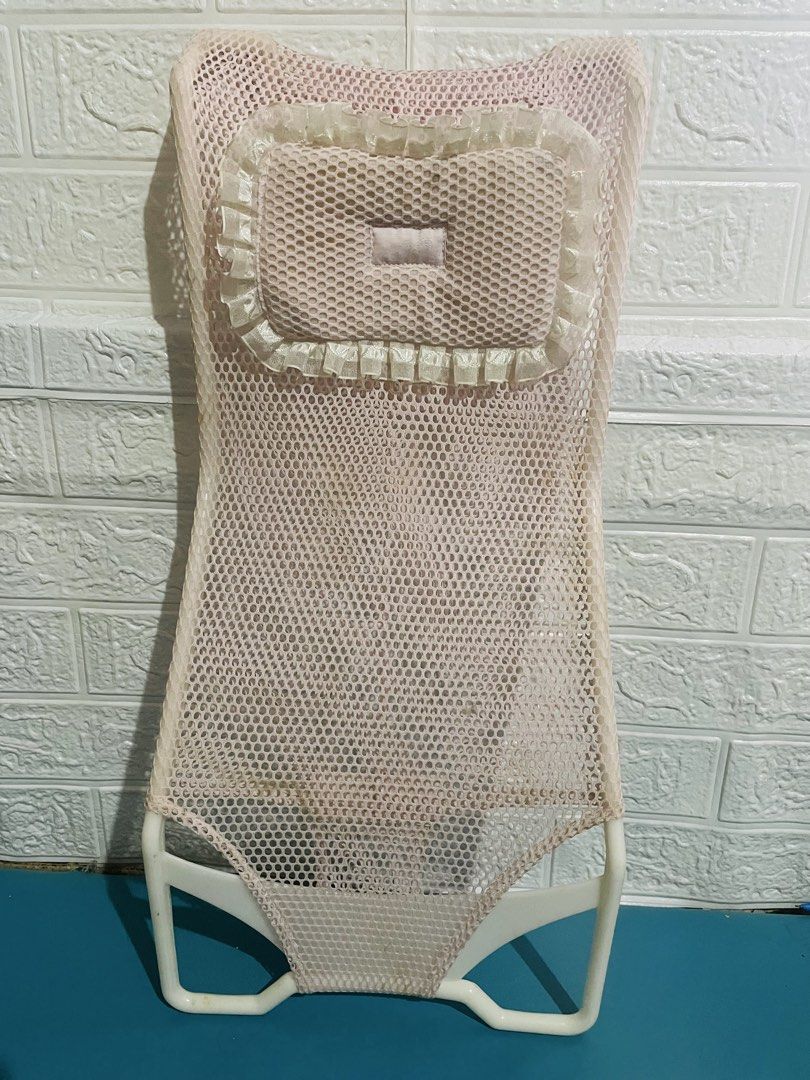 Baby Bath Net Support Stand Pink Mesh (Category: Bathtub & Bath Accessories) located in Manila. Submitted by myshanshine (Listing ID 1469162333, Image 1). Description: - Color: Pink mesh with white frame - Features: Padded headrest pillow with cute ruffles - Material: Breathable mesh for fast drying - Safety: Sturdy plastic frame for secure support during bath time - Fit: Perfectly sized for standard baby tubs.
