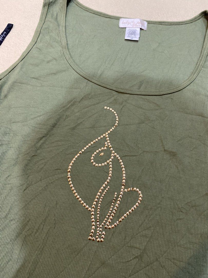 Baby phat top (Category: Sleeveless) located in Tanza. Submitted by 9th.street.thrift (Listing ID 1469165216, Image 3). Description: Baby phat top Good as new No issue Xl on tag 21.5x26.5 .