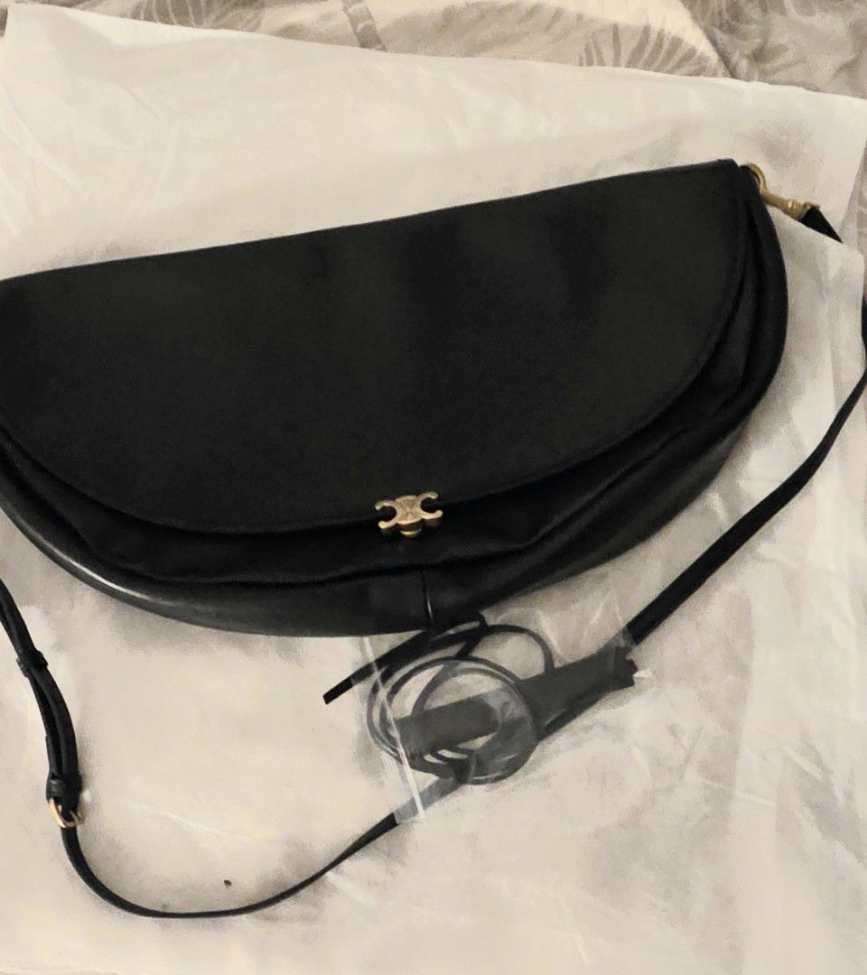 Bag For Sale (Category: Cross-body Bags) located in Pasig City. Submitted by icarlah (Listing ID 1469301046, Image 3). Description: - C3line half moon - premium black leather parang orig - Includes an adjustable strap - Versatile design that matches any outfit - Condition: Excellent / Mint - Mode of Payment: Gotyme/ GCash - Shipping via Grab LALAMOVE - feel free to check if meet up.