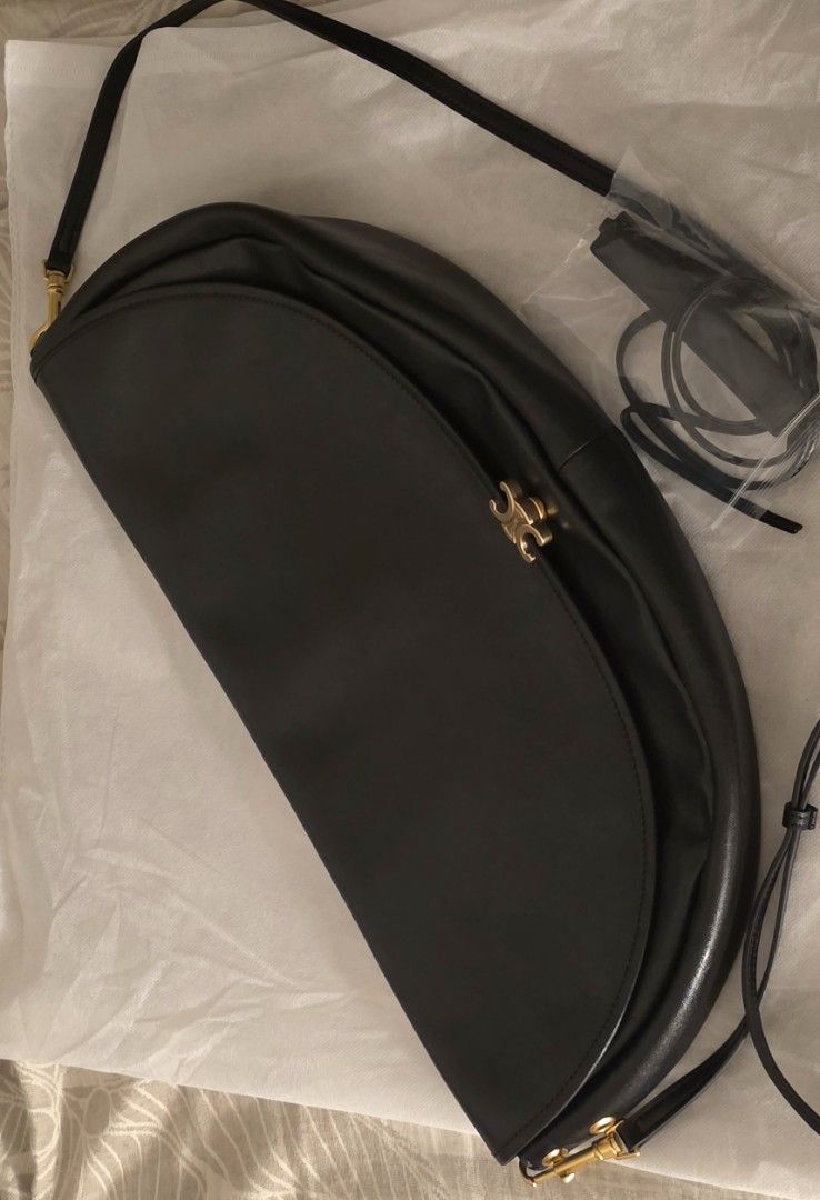 Bag For Sale (Category: Cross-body Bags) located in Pasig City. Submitted by icarlah (Listing ID 1469301046, Image 1). Description: - C3line half moon - premium black leather parang orig - Includes an adjustable strap - Versatile design that matches any outfit - Condition: Excellent / Mint - Mode of Payment: Gotyme/ GCash - Shipping via Grab LALAMOVE - feel free to check if meet up.