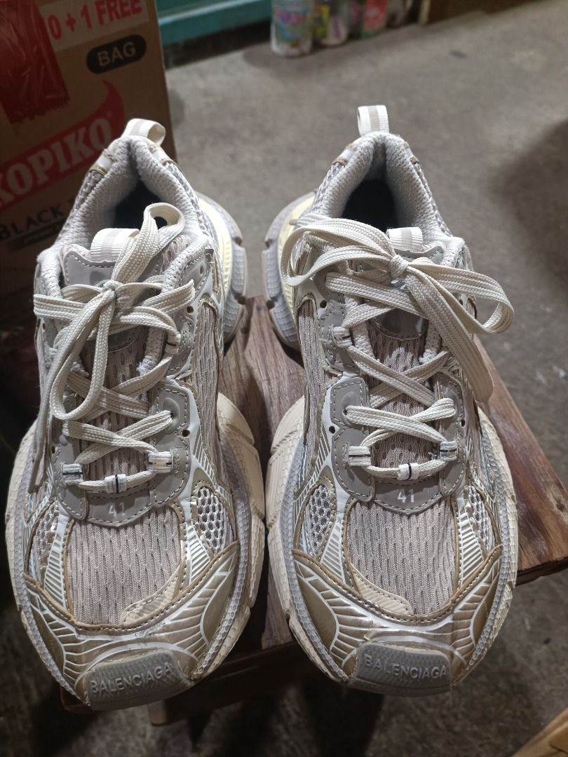 Balenciaga 10X Runner Sneakers Size 41 (Category: Sneakers) located in Cabuyao City. Submitted by claybishop (Listing ID 1469275736, Image 2). Description: - Brand: Balenciaga 10X Runner - Colorway: Beige and grey - Size: 41 (stamped on front and tongue) - Material: Chunky mesh and polyurethane with distressed detailing - Design: Thick laces and segmented rubber outsole - Condition: Previously worn with minor dirt on the soles.