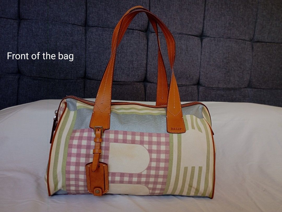 Bally Switzerland (Category: Shoulder Bags) located in Puerto Princesa. Submitted by sefynna96 (Listing ID 1469241581, Image 2). Description: Brand Bally (Switzerland) ✨Canvas body with tan calfskin leather handles, tag, and trim ✨Boston-style barrel or shoulder bag with a top zipper closure ✨Multicolored pastel and neutral geometric/plaid canvas pattern with a branded leather patch height: 10 and a half inches width: 13 and a half inches large i