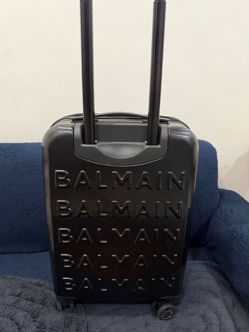 Balmain Luggage Suitcase Set Black (Category: Luggage) located in Caloocan City. Submitted by katewilson28573 (Listing ID 1469335926, Image 2). Description: - Authentic Balmain hard shell luggage set in sleek black - Includes two matching sizes with embossed logo lettering - Smooth spinner wheels and retractable handles for easy travel - Secure zip closures to keep belongings safe - Brand new with original store tags still attached.