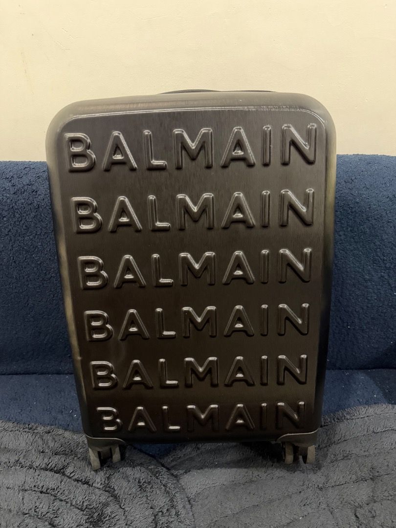 Balmain Luggage Suitcase Set Black (Category: Luggage) located in Caloocan City. Submitted by katewilson28573 (Listing ID 1469335926, Image 1). Description: - Authentic Balmain hard shell luggage set in sleek black - Includes two matching sizes with embossed logo lettering - Smooth spinner wheels and retractable handles for easy travel - Secure zip closures to keep belongings safe - Brand new with original store tags still attached.