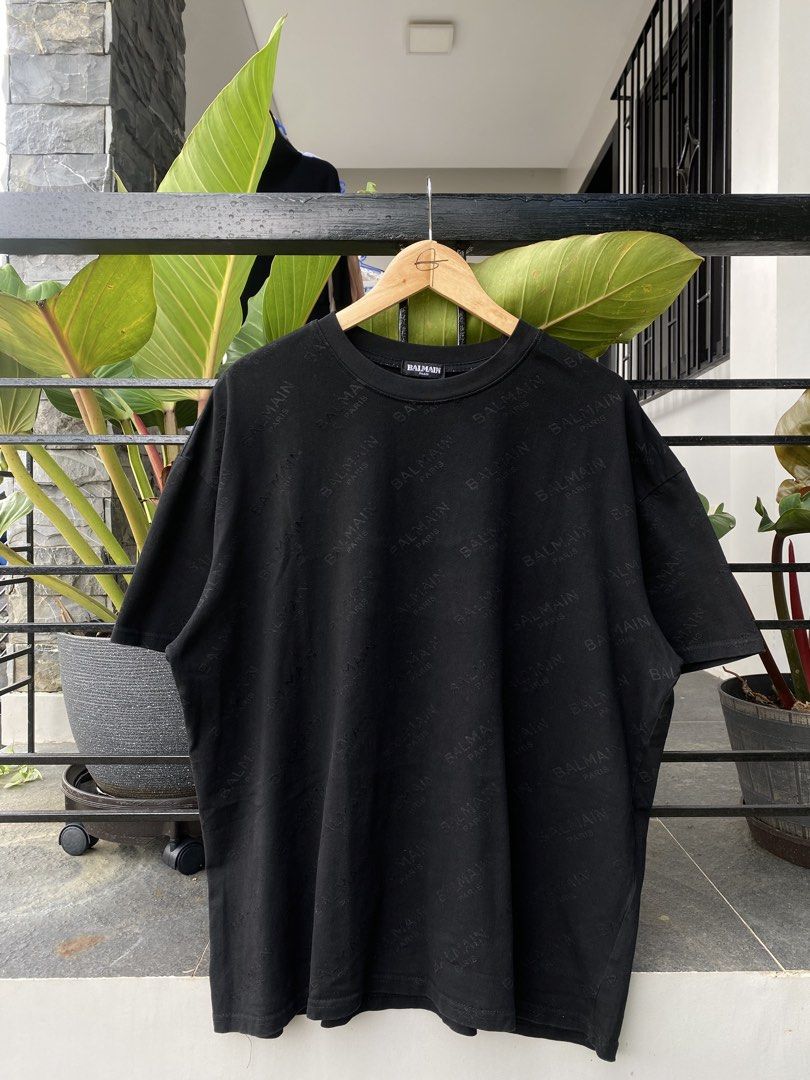 Balmain Paris Black Monogram T-Shirt (Category: Luxury Apparel) located in Roxas City. Submitted by dua-garments23 (Listing ID 1469206840, Image 1). Description: - Brand: Balmain Paris - Item: Black short sleeve t-shirt with all-over debossed logo pattern - Material: 100% cotton (main), viscose and silk blend (lining) - Neckline: Classic crew neck - Origin: Made in Portugal - Style Code: 18S 7369 342 - Condition: Great piece for casual wear, very