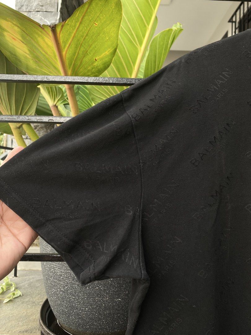 Balmain Paris Black Monogram T-Shirt (Category: Luxury Apparel) located in Roxas City. Submitted by dua-garments23 (Listing ID 1469206840, Image 3). Description: - Brand: Balmain Paris - Item: Black short sleeve t-shirt with all-over debossed logo pattern - Material: 100% cotton (main), viscose and silk blend (lining) - Neckline: Classic crew neck - Origin: Made in Portugal - Style Code: 18S 7369 342 - Condition: Great piece for casual wear, very