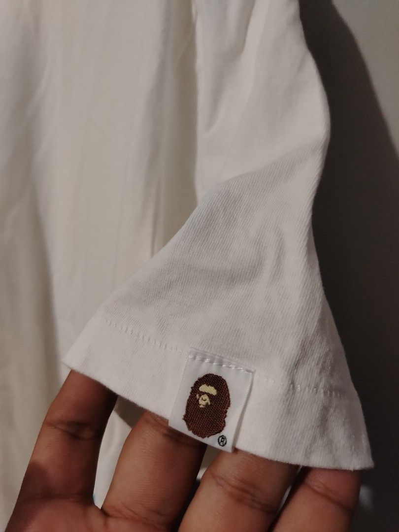 Bape (Category: Tshirts & Polo Shirts ) located in Bocaue. Submitted by adrianberi35876 (Listing ID 1469251163, Image 3). Description: Bape Width:24.8 Length:28 Condition:8.5/10 Color Rate:8.5/10 Issue:Fading sa print back part (check the last photo).