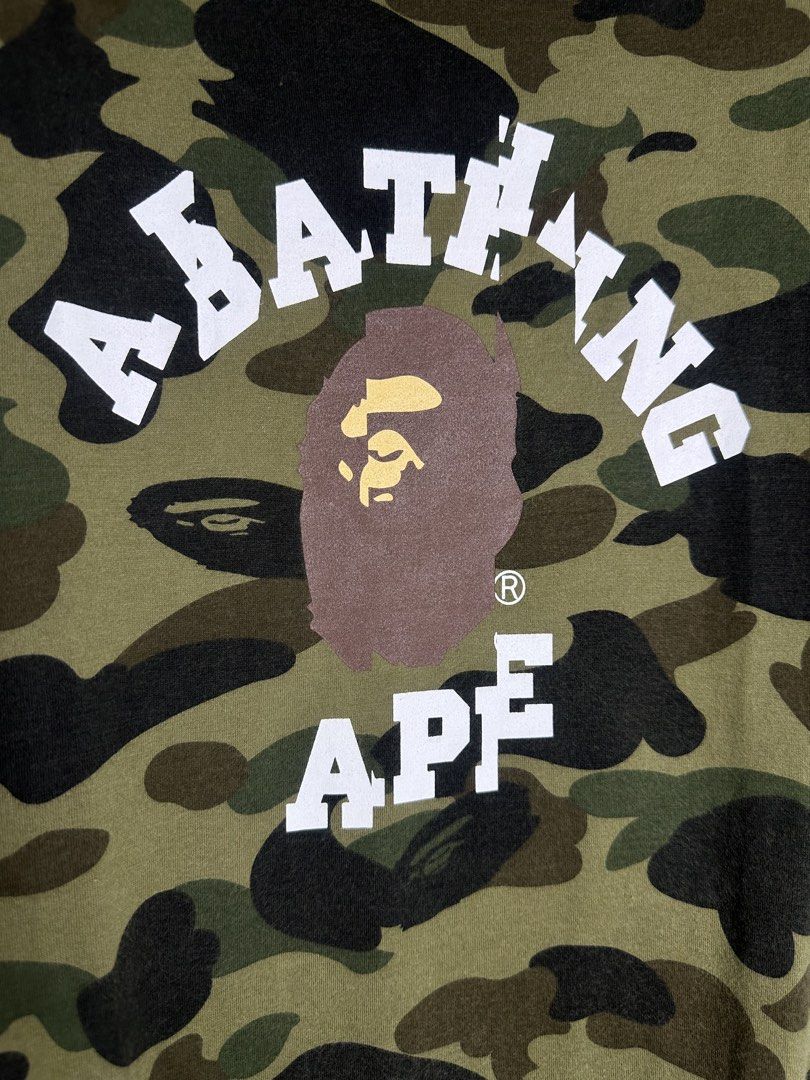 Bape 1st Camo Collage Tee (Category: Shirts) located in Marikina City. Submitted by swiftsian (Listing ID 1469175548, Image 2). Description: Authentic Bape 1st Camo Collage Tee - Size: Small (Women's) - Issue: None - Manage your expectations. Some issues may not be seen or indicated. - Color may vary due to lighting Shipping: Lalamove/J&T .