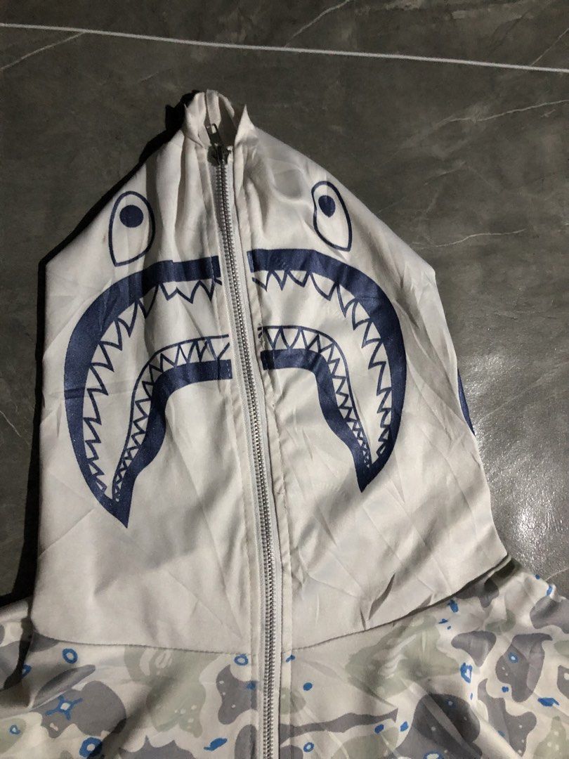 Bape shark full zip wind breaker type (Category: Coats, Jackets and Outerwear) located in Manila. Submitted by buksthrifthing (Listing ID 1469213778, Image 3). Description: 28 by 28 Can fit to large , xL and 2xL No issues No tag (probably off) Goods for psg.