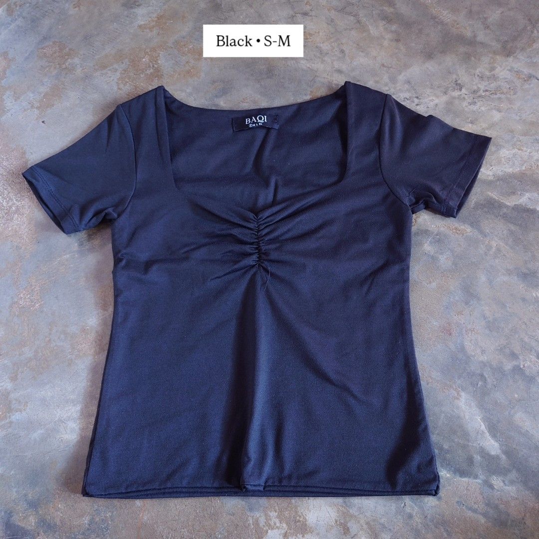 BAQI Black Square Neck Ruched Top S-M (Category: Sleeveless) located in Diffun. Submitted by declutteredbyJill (Listing ID 1469236377, Image 1). Description: - Brand: BAQI - Size: S-M (labeled at collar) - Color: Solid Black - Fit: Slim fit with stretch - Design: Square neckline with ruched center detail - Styling: Perfect to pair with high-waisted jeans or skirts.
