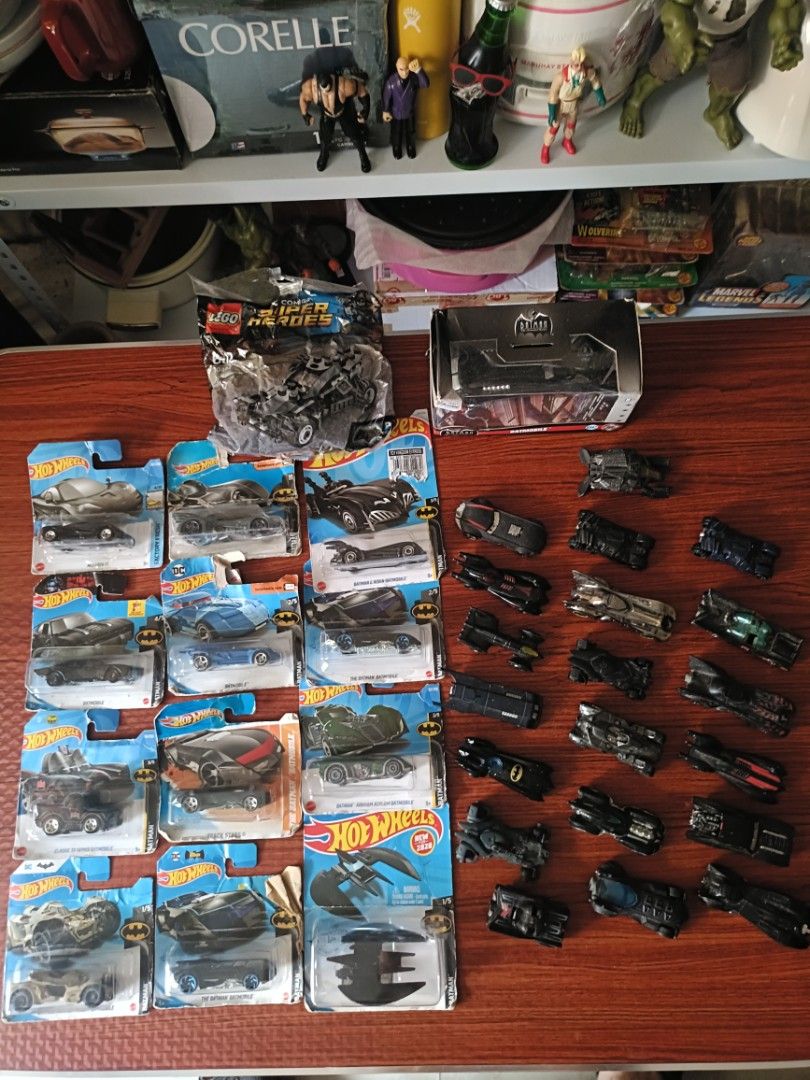 Batman Hot Wheels and LEGO Batmobile Collection (Category: Vehicle & Diecast Models) located in Manila. Submitted by livewater.ebbc17 (Listing ID 1469314852, Image 1). Description: - Massive Batman diecast cars and LEGO set collection - Includes multiple carded and loose Hot Wheels Batmobiles from various series - Comes with a bagged LEGO Super Heroes Tumbler - Mostly dark colorways (black, grey, blue) across different eras and movie designs - Gr