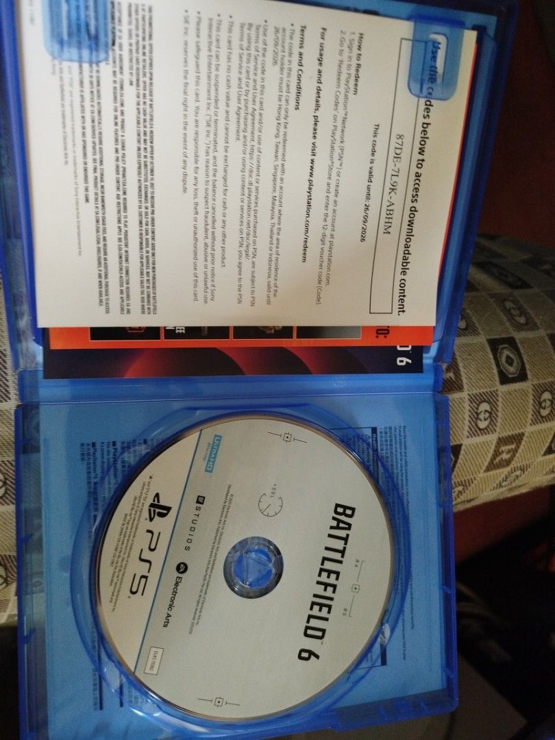 Battlefield 6 PS5 Game Disc (Category: PlayStation) located in Manila. Submitted by liveflower-2ec769 (Listing ID 1469210048, Image 2). Description: - Game: Battlefield 6 for PlayStation 5 - Condition: Physical disc in pristine, clean condition with original blue case - Extras: Includes DLC code slip (valid until 26/09/2026) - Details: Region code and rating labels intact on front cover - Shipping: Fast shipping and securely packed.