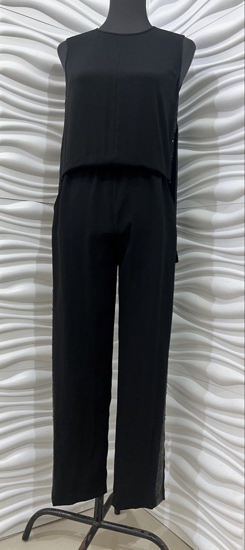 BCBGMAXAZRIA Black Sequin Trim Jumpsuit (Category: Jumpsuits) located in Las Pinas. Submitted by sabsking (Listing ID 1469170113, Image 1). Description: - Brand: BCBGMAXAZRIA - Color: Black - size can fit small to med - Design: Sleeveless with open back detail - Accent: Eye-catching sparkly sequin trim down both sides - Fit: Straight leg pants with a waist strap for a flattering silhouette - Closure: Button closure at the back neck ₱1000 plus sf.
