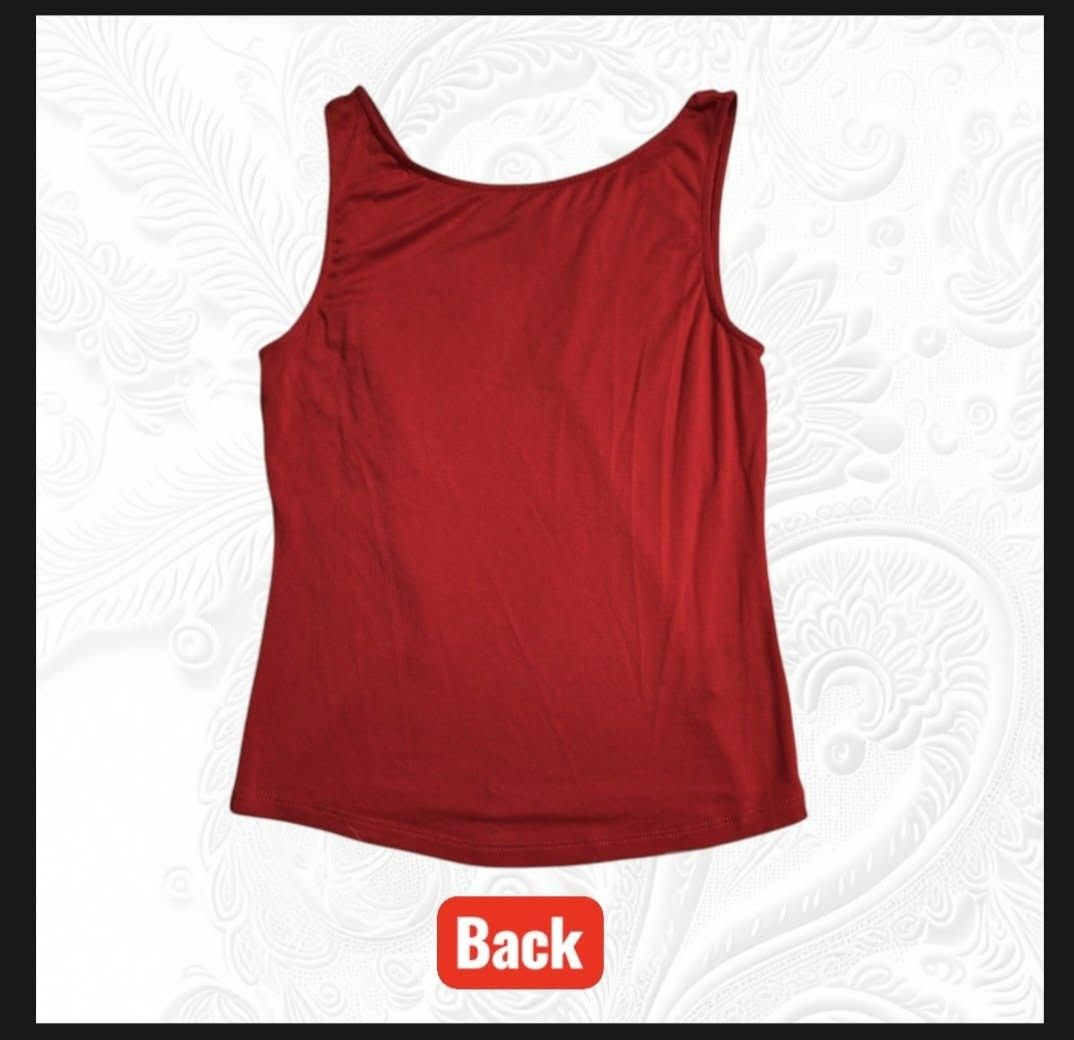 bebe Addiction Red Tank Top Size M (Category: Sleeveless) located in Paranaque City. Submitted by calm_youngstore7 (Listing ID 1469320028, Image 3). Description: - Brand: bebe Addiction - Color: Bright Red - Size: Medium - Material: Soft and stretchy fabric - Design: Classic scoop neckline on front and back - Origin: Made in USA - Condition: Great basic for layering or wearing on its own.