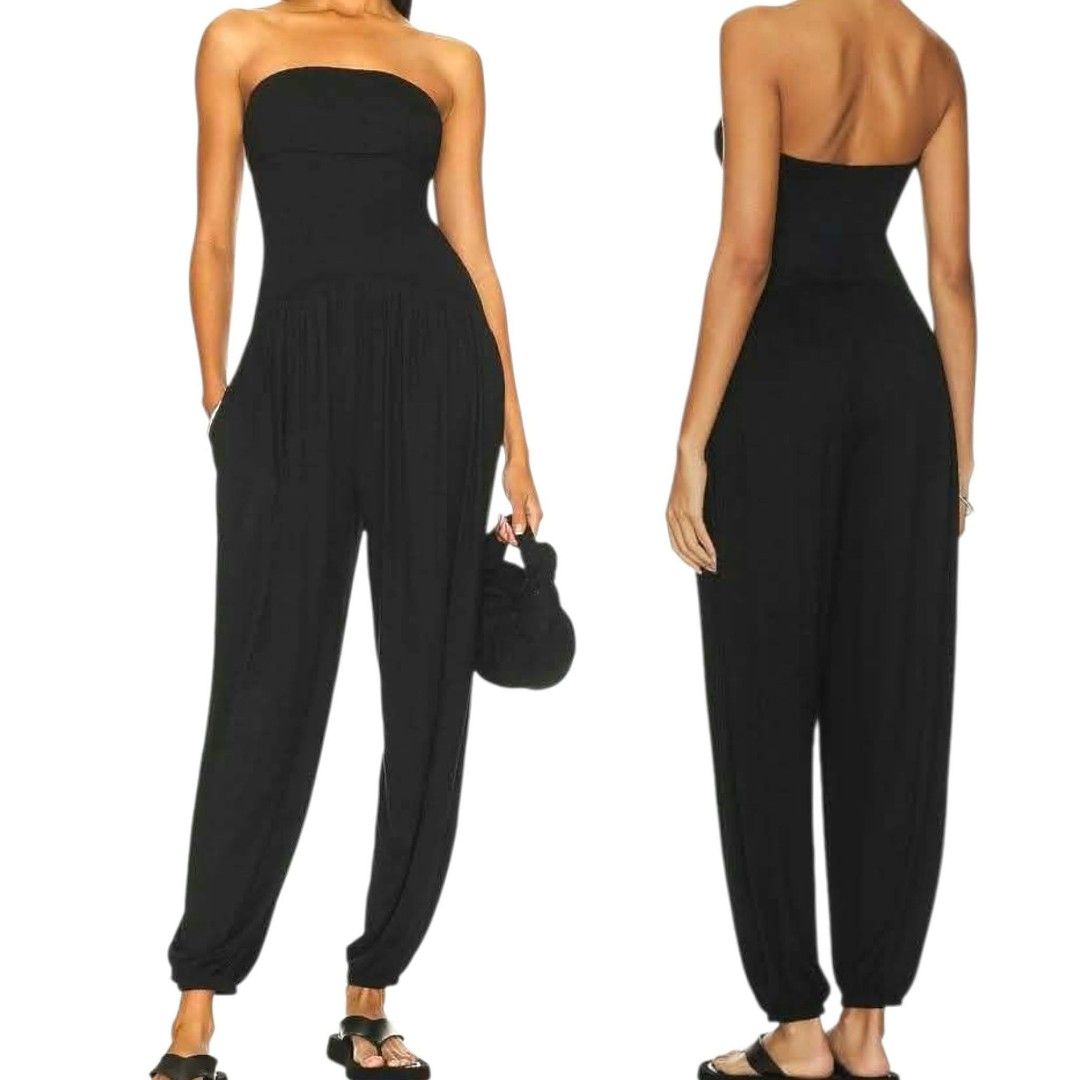 Bebe Black Strapless Tube Jumpsuit with Pockets (Category: Jumpsuits) located in Paranaque City. Submitted by calm_youngstore7 (Listing ID 1469319396, Image 2). Description: - Color: Solid black - Style: Strapless tube top jumpsuit with gathered bodice detail - Fit: Relaxed harem-style pants with fitted ankles and easy pull-on design - Practicality: Features handy side pockets - Material: Lightweight and stretchy for all-day comfort.