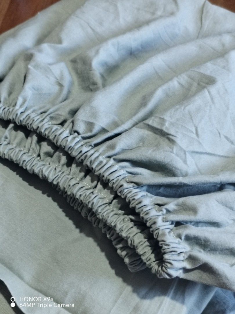 Bedsheet & Flatsheet ( Queen size) (Category: Bedding & Towels) located in Muntinlupa City. Submitted by arciagamaryann68 (Listing ID 1469218358, Image 3). Description: - Item: Queen size bedsheet & flatsheet set - Color: Sage green - Features: Fully elasticized fitted sheet for a secure fit - Condition: Good, well-kept - Ideal for updating your bedroom decor with a cozy and relaxing vibe.