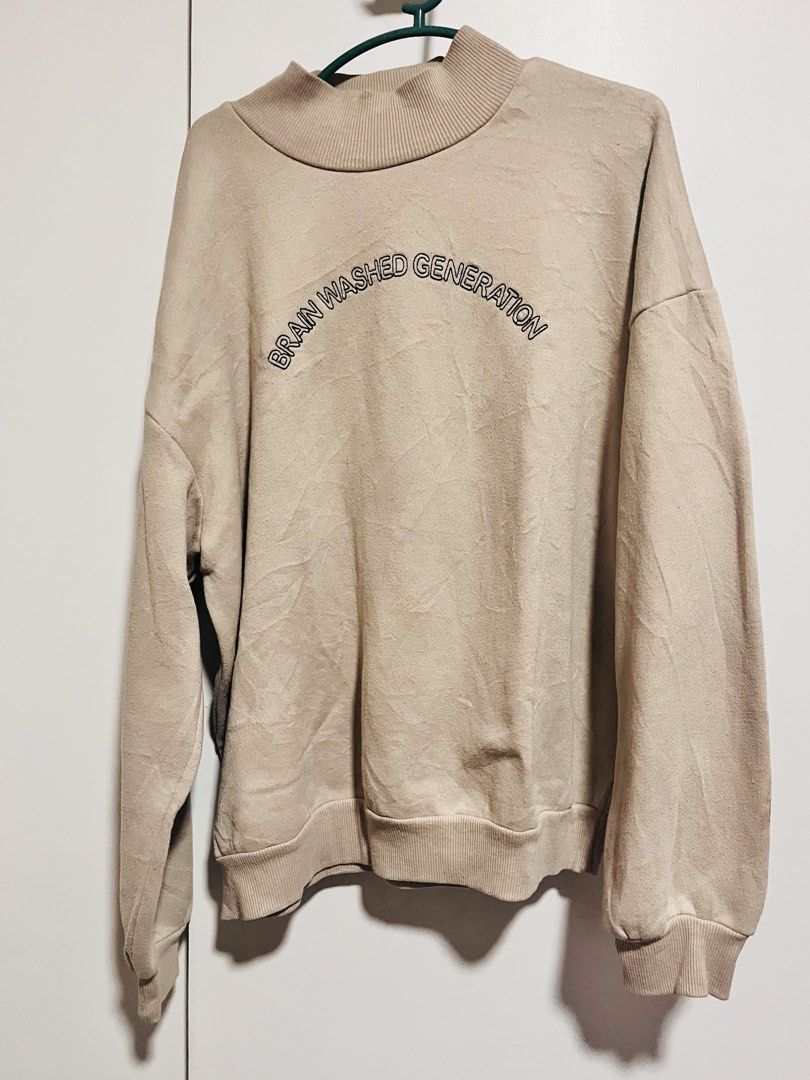 Beige Brain Washed Generation Mock Neck Sweatshirt (Category: Coats, Jackets and Outerwear) located in Paranaque City. Submitted by swiftdragon_cf5b78 (Listing ID 1469335325, Image 1). Description: - Color: Beige - Fit: Oversized / Relaxed with dropped shoulders - Details: Mock neck collar and 'Brain Washed Generation' chest graphic - Comfort: Fleece-lined interior for extra warmth - Material: Soft cotton blend - Finish: Ribbed cuffs and hem - Co