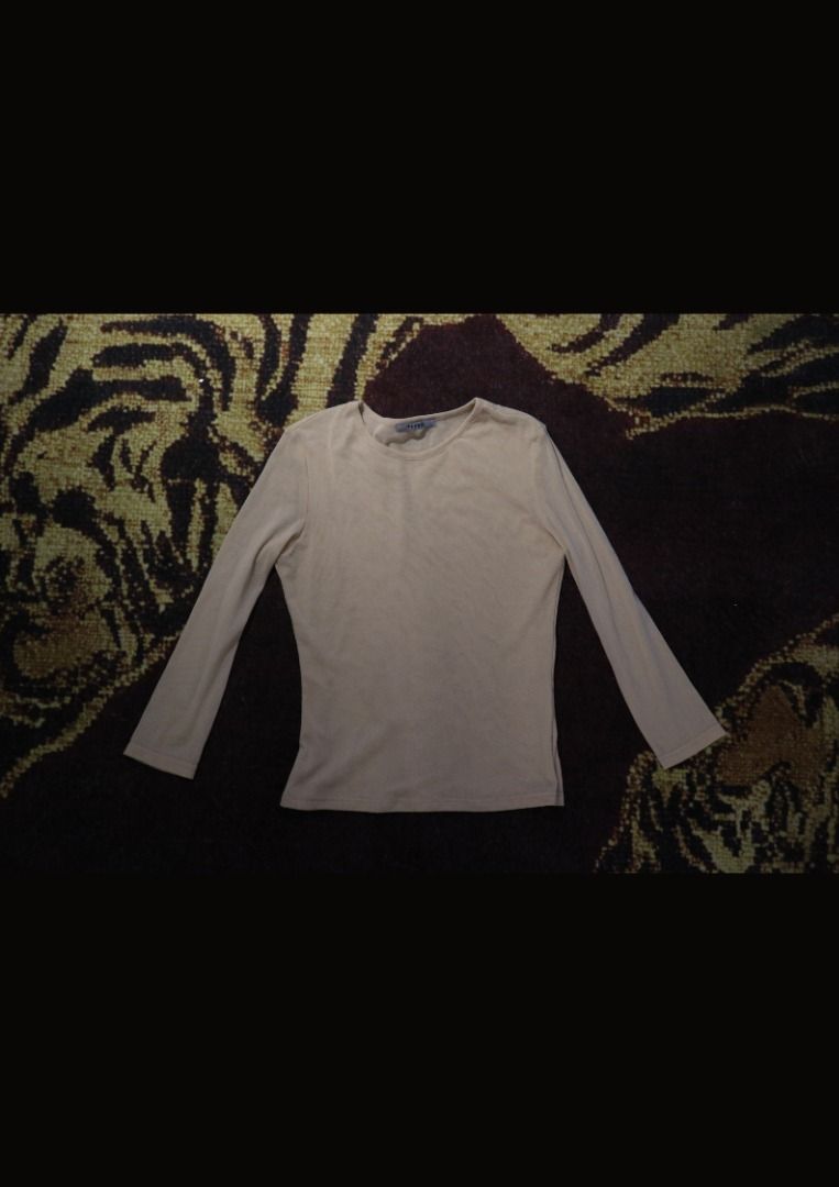 Beige Sheer Three-Quarter Sleeve Top (Category: Blouses) located in Paranaque City. Submitted by skulkch (Listing ID 1469362413, Image 3). Description: - Color: Nude beige - Material: Lightweight, stretchy sheer mesh - Design: Round neckline, 3/4 length sleeves - Versatility: Perfect as a layering piece or worn on its own - Condition: Excellent, clean collar and hem with no stains or rips.