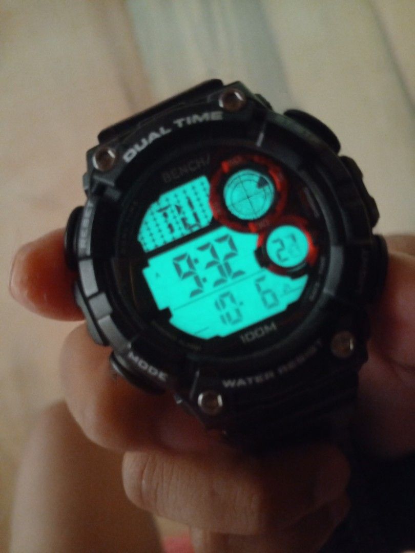 Bench BH2666Y Dual Time Digital Watch (Category: Men's Watches) located in Manila. Submitted by melantha12 (Listing ID 1469260342, Image 3). Description: - Brand: Bench - Model: BH2666Y - Display: Dual time digital display - Water Resistance: 100M (Great for swimming and daily wear) - Design: Dark grey resin case and strap with striking red dial accents - Backlight: Working bright green backlight for low-light visibility - Case Back: Durable stai