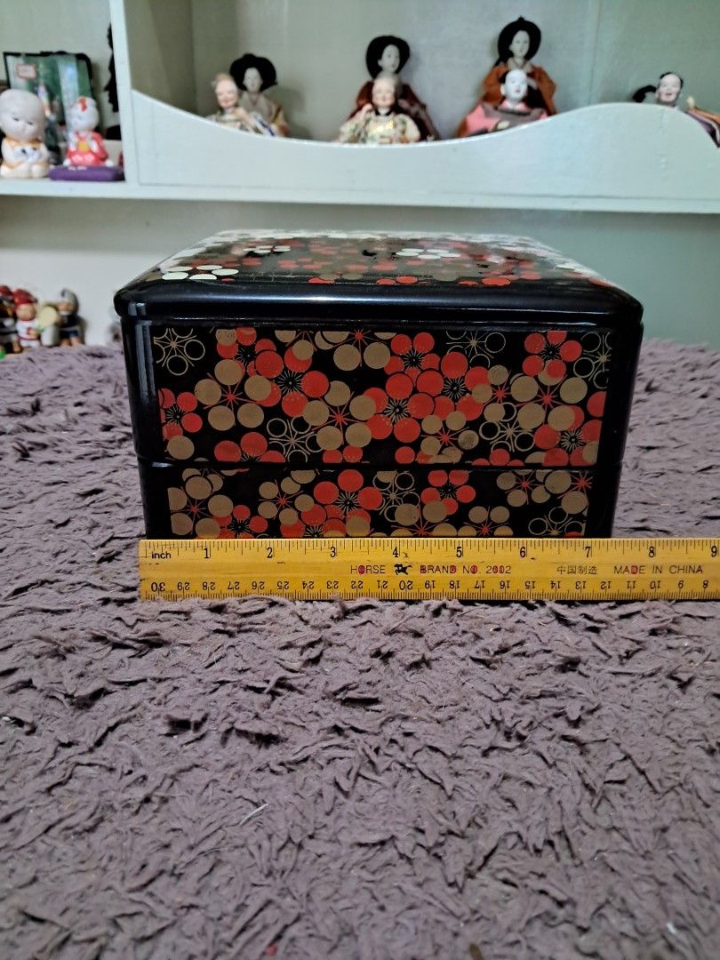 Bento box (Category: Food Organization & Storage) located in Cavite. Submitted by secretjapansurplus (Listing ID 1469221040, Image 1). Description: • Condition: Brand New Old Stock (BNOS). The lacquer finish retains its brilliant showroom shine, and the interior and exterior are completely clean with no chips or cracks. The original outer cardboard box shows minor signs of shelf and storage wear due to its age, adding to its genuine vintage charm