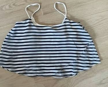Bershka Striped Crop Top (Category: Shirts) located in Paranaque City. Submitted by calm_youngstore7 (Listing ID 1469284689, Image 2). Description: LAST PIECE SALE! - Brand: Bershka - Size: Medium - Condition: Brand new with tags (BNWT), never worn - Design: Black and white horizontal stripes, spaghetti straps - Material: Lightweight, flowy layered sheer fabric - Perfect for: Warm weather or stylish layering.