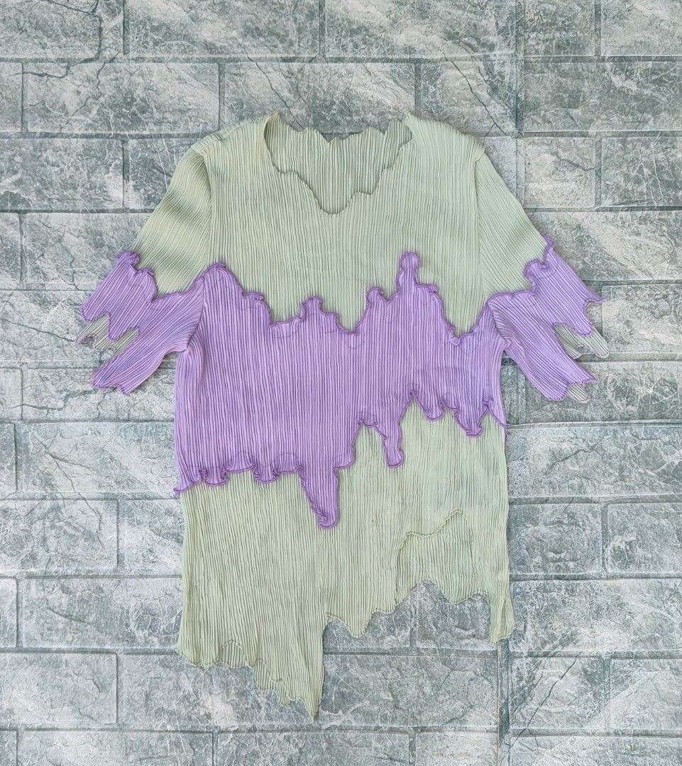 bibilee studio pleated green purple top (Category: Sleeveless) located in Bayambang. Submitted by mon10192816 (Listing ID 1469268753, Image 1). Description: - Issue Dot stain, not visible check last photos - Bibilee studio pleated top in light green and purple - Asymmetrical hemline with lettuce edge trim Short sleeves - 100% polyester material.