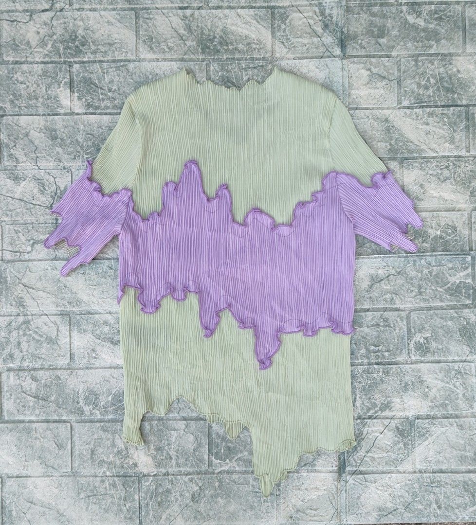 bibilee studio pleated green purple top (Category: Sleeveless) located in Bayambang. Submitted by mon10192816 (Listing ID 1469268753, Image 2). Description: - Issue Dot stain, not visible check last photos - Bibilee studio pleated top in light green and purple - Asymmetrical hemline with lettuce edge trim Short sleeves - 100% polyester material.