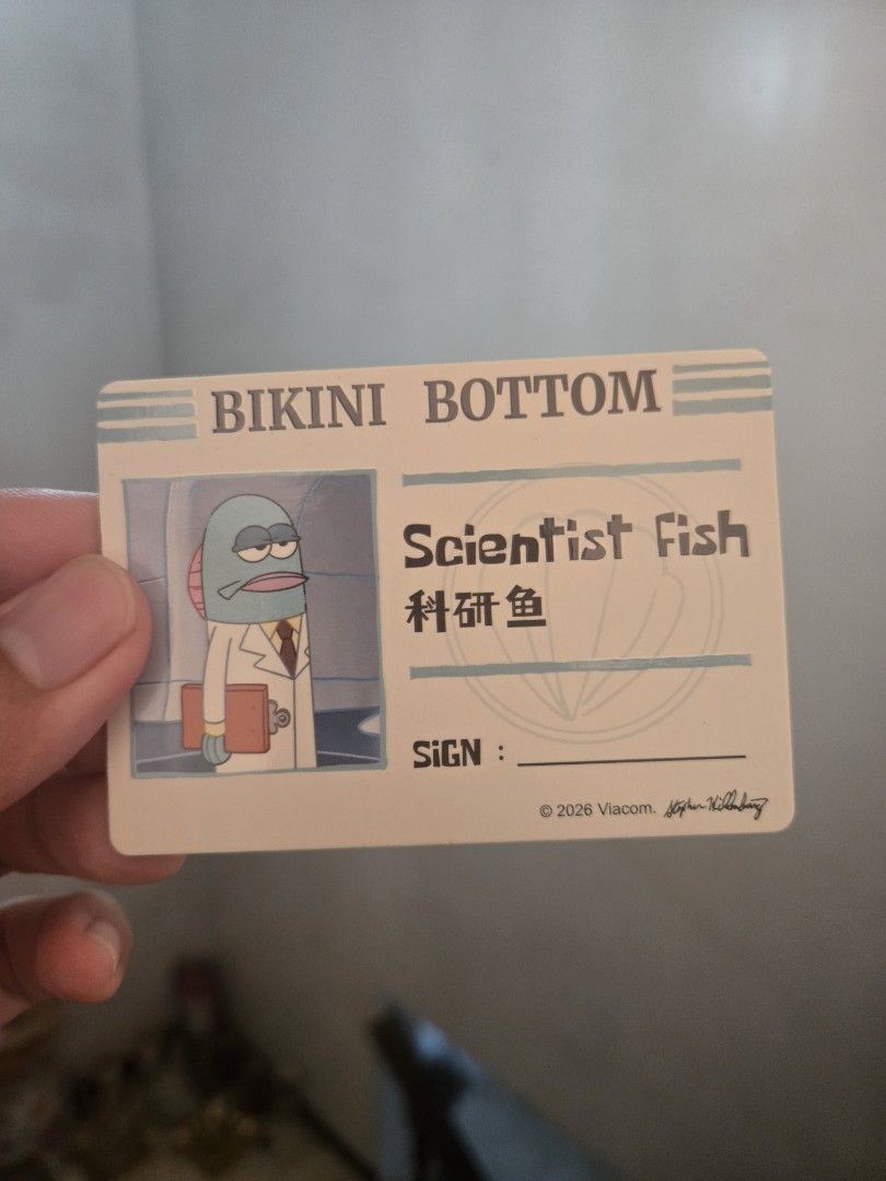 Bikini Bottom Buddies - Scientist Fish Plush Keychain (Category: Plushies & Soft Toys) located in Marikina City. Submitted by parcelpal.store (Listing ID 1469164662, Image 3). Description: - Official SpongeBob SquarePants Bikini Bottom Scientist Fish plush keychain - Design: Blue fish in a white lab coat holding a clipboard - Bonus: Includes a matching character art ID card - Size: Palm-sized, perfect for bags and keys - Hardware: Attached clasp 
