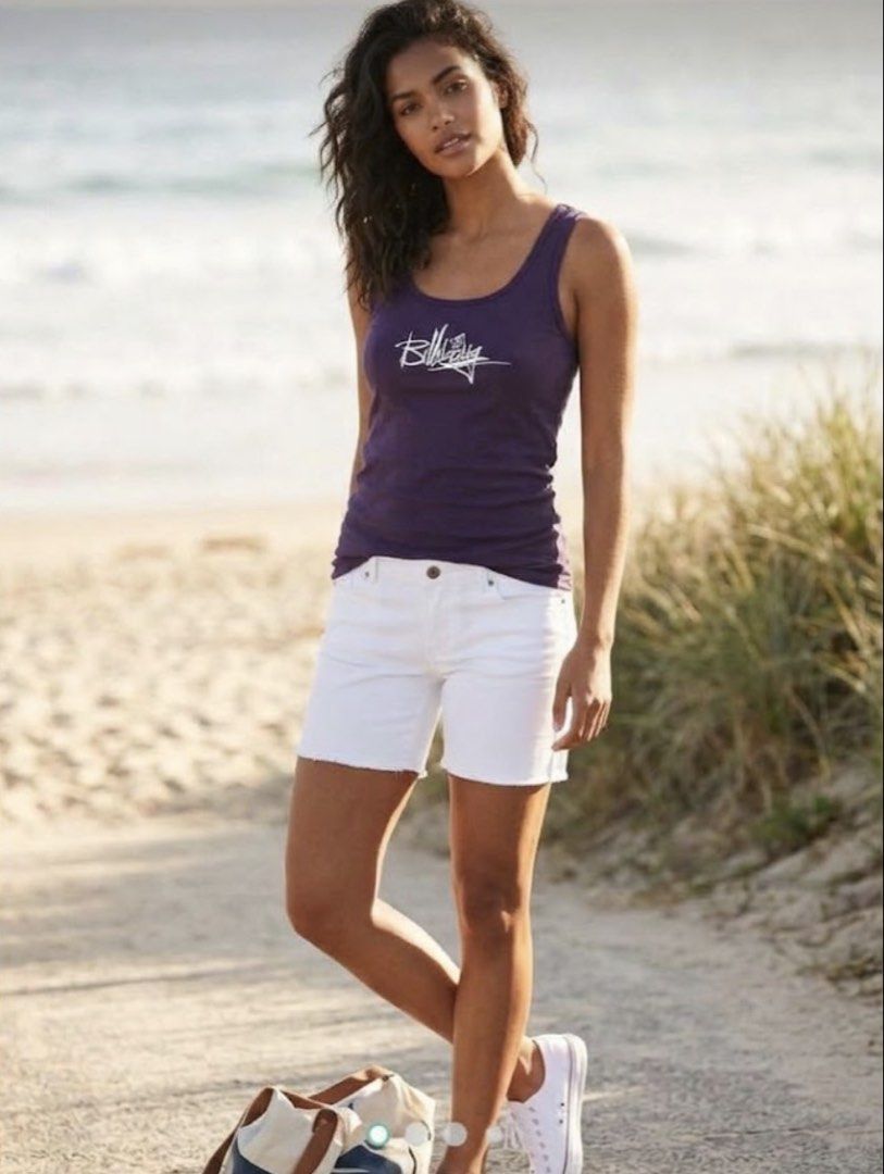 Billabong Purple Graphic Tank Top (Category: Sleeveless) located in Manila. Submitted by rayuki39 (Listing ID 1462819017, Image 1). Description: - Brand: Billabong - Color: Purple - Style: Tank top - Features: Cool graphic print, Billabong logo, 'new collection' text - Occasion: Casual wear.